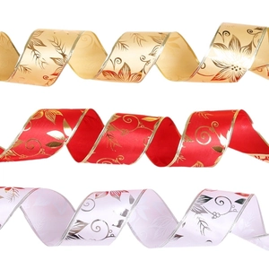Christmas ribbons with gold edges and floral prints in red, gold, and lavender colors