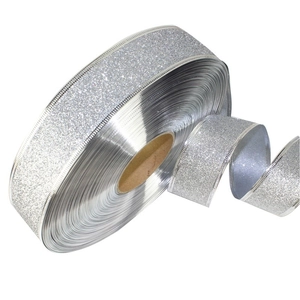 Detail of silver glitter ribbon with wired edges for Christmas tree decoration and gift wrapping