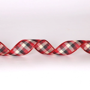 Detail of red and black buffalo plaid ribbon with metallic wire edges for Xmas decor