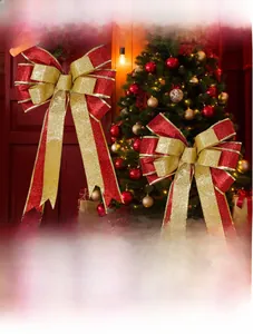 Detail of a large red and gold glitter bow with metallic edges for Christmas tree decoration