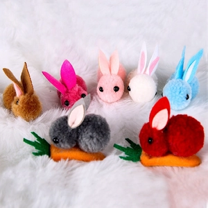 Detail of colorful pom-pom bunny hair clips for Easter party costumes and hair accessories