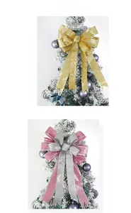 Detail of glitter fabric Christmas tree topper bows with wired edges in gold and silver