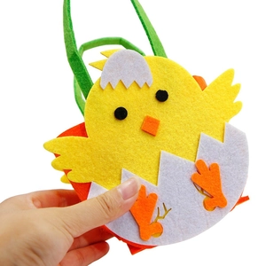 Easter felt gift bag featuring a yellow chick egg shell design with green handles