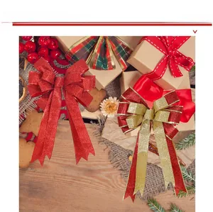 Detail of red and gold glitter double-layer Christmas bow on a festive wooden table