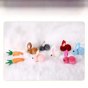 Detailed close-up of mini plush Easter bunnies in various colors with soft fabric texture