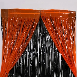 Halloween orange and black foil fringe curtain for spooky party backdrop decoration