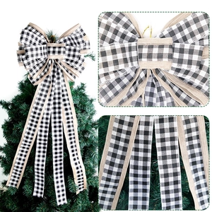 Large black and white buffalo plaid Christmas tree topper bow with faux burlap edges