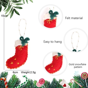 Red felt Christmas stocking ornament with gold snowflake embroidery and green bow detail