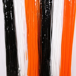 Vertical tinsel foil curtains in black white and orange for Halloween party background