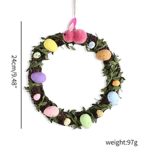 Detailed view of a 24cm Easter rattan wreath with colorful eggs and a pink plush bunny