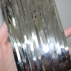 Silver metallic fringe curtain for birthday parties and festive wall decorations