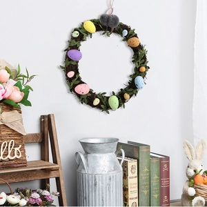 Easter wreath detail with speckled colorful eggs and plush rabbit on natural rattan vine