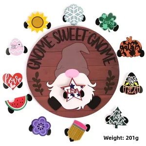Detail of wooden door sign with gnome sweet gnome text and various seasonal interchangeable icons