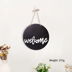 Detail of a round welcome door sign in black wood with hanging rope weighing 157g