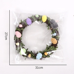 Close-up of Easter rattan wreath with colorful speckled eggs and bunny decor 31x27cm