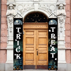 Halloween Trick or Treat porch banners hanging on vintage doors for festive party decoration