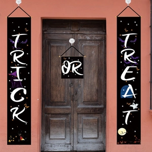 Three-piece Halloween trick or treat door banners with bats and ghost on a vintage door