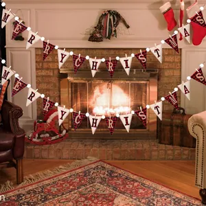 Merry Christmas banner with red plaid pennants hanging on a cozy fireplace mantel