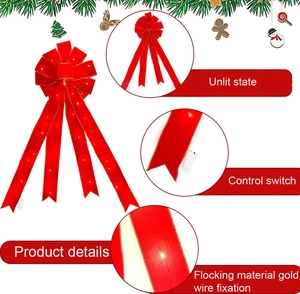 Détail du nœud de Noël rouge avec LED montrant texture, interrupteur et boîtier piles