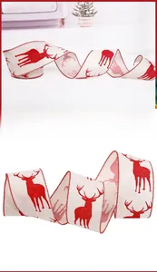 Close-up of festive cream linen Christmas ribbon with red reindeer print and stitched edges