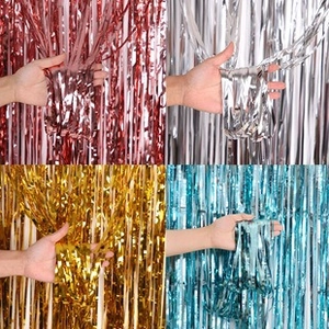 Fringe curtains in rose gold, silver, gold, and blue for festive party backdrop decor