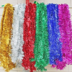 Close-up of 2m colorful Christmas tinsel garlands in gold, silver, red, green and blue