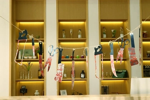 Detailed view of bloody paper weapon banner with scissors and saws for Halloween party