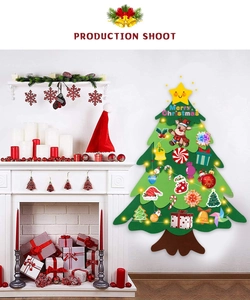 Detail of DIY felt Christmas tree with decorative ornaments and Merry Christmas sign