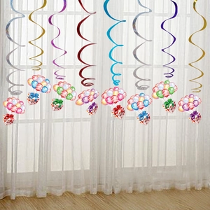 Close-up of metallic PVC ceiling swirls with colorful balloon and gift box pendants