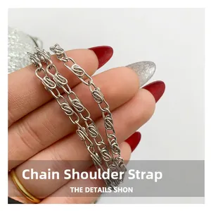 Detail of silver metallic crossbody chain strap with interlocking links for handbags