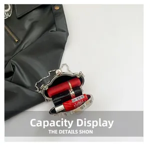 Cloud-shaped silver sequin clutch showing internal capacity with lipstick and metal chain