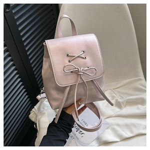 Pink minimalist PU leather backpack with decorative front bow and crossover laces design