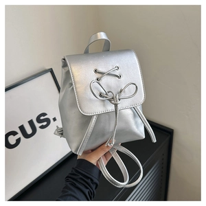 Mini silver metallic PU leather backpack with decorative lace-up detail and top handle