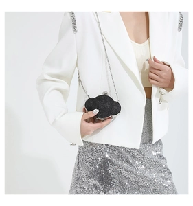Fashionable cloud-shaped evening bag with black glitter texture and silver chain strap