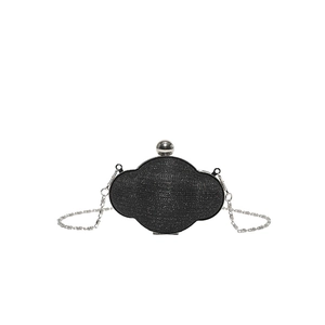Sparkly black starburst evening clutch bag with wavy frame and silver chain strap