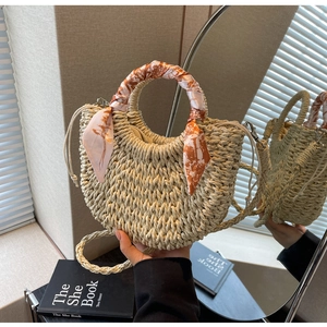 Minimalist woven straw handbag with silk scarf handle and drawstring lining for women