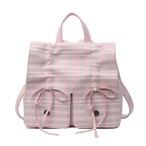 Pink and white checkered backpack with bow decoration and top leather handle