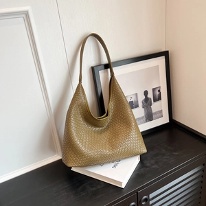 Chic dark green woven leather tote bag for women featuring classic Intrecciato style