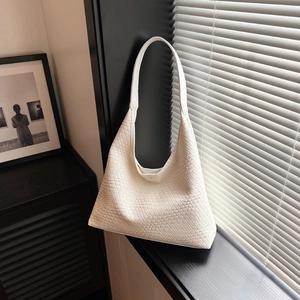 Minimalist white woven leather tote bag with wide strap in hobo style and large capacity