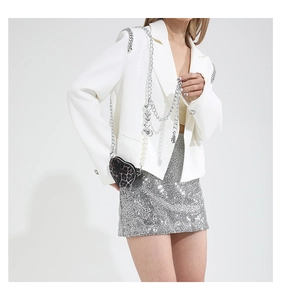 Detail of leopard print heart-shaped mini bag with luxury pearl and silver chain strap