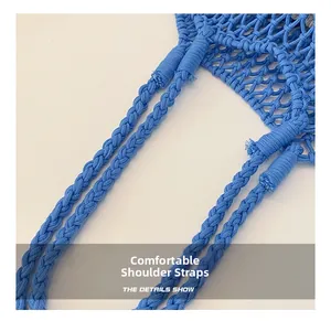 Close-up of the handcrafted blue woven shoulder strap with intricate braided texture