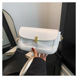 Minimalist white PU leather crossbody bag with a gold metal lock and shoulder strap