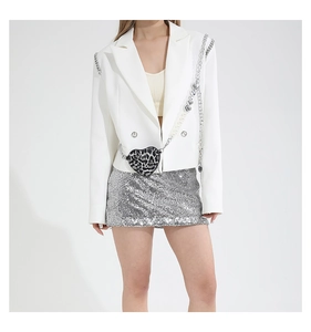 Close-up of heart-shaped leopard print crossbody bag with pearl and metal chain details