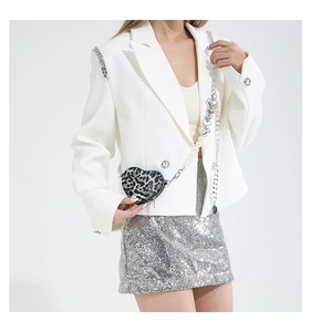 Detail of leopard print heart-shaped crossbody bag with pearl and heart chain strap