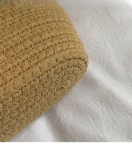 Macro detail of the khaki hand-woven fabric texture with compact interlaced mesh pattern