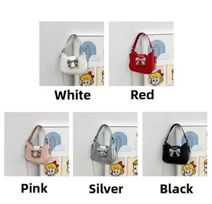 Detail view of five PU leather handbags with metal bow buckles and chain straps