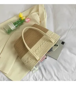 Detail view of woven fabric tote bag showing spacious interior and knit texture