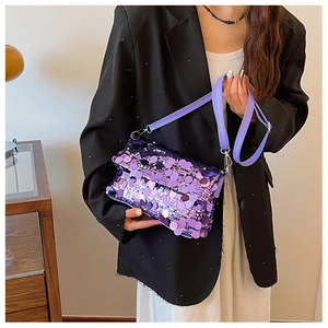 Detail of purple sequin crossbody bag showing shiny round scales and adjustable strap