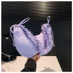 Chic lavender puffer crossbody bag with ruffle trim design and soft quilted nylon fabric