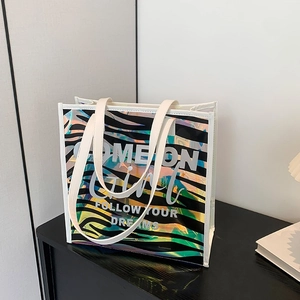 Fashionable laser tote bag with zebra stripes and Come On Girl print on wooden surface